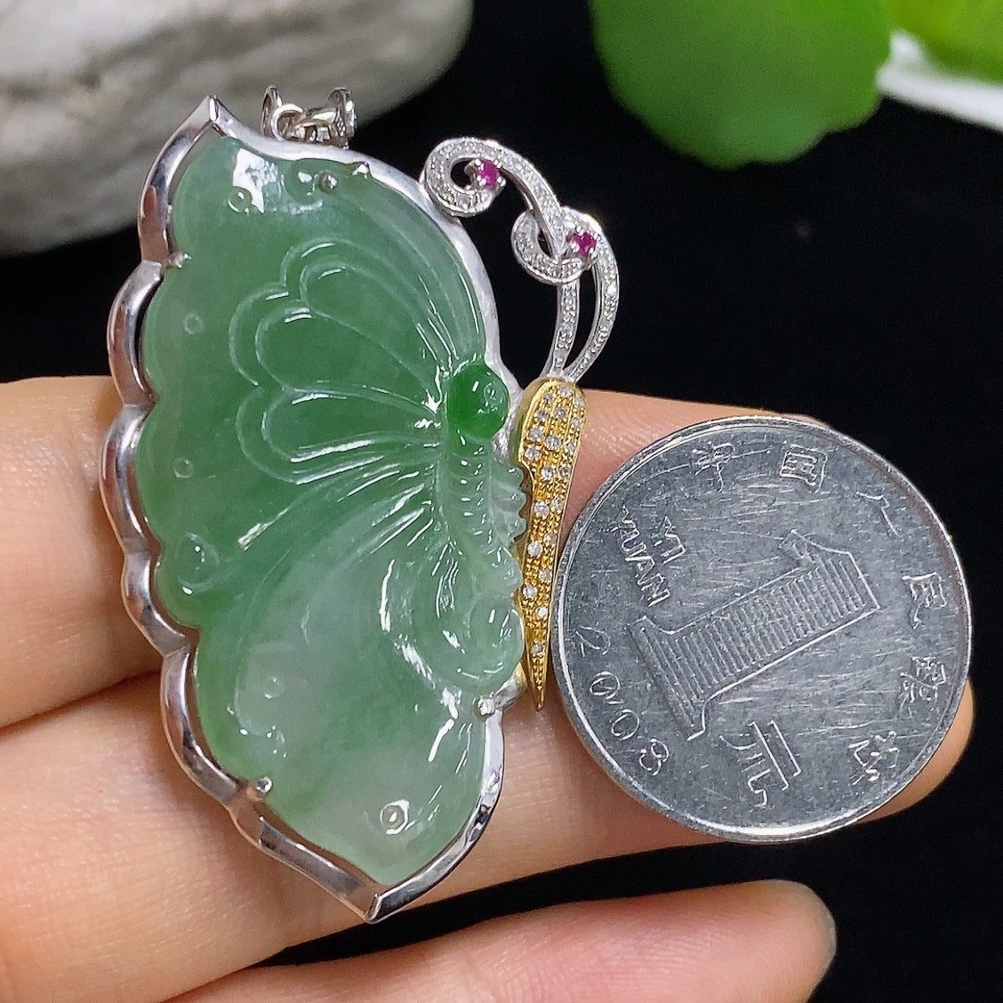 Jadeite butterfly pendant with 18k gold and diamond accents, featuring a detailed jade design and elegant craftsmanship.