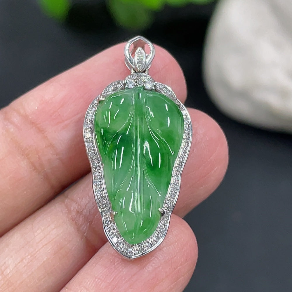 Jadeite leaf inlay pendant with 18k gold and diamond accents, weighing approximately 3 grams, by HKHQ.