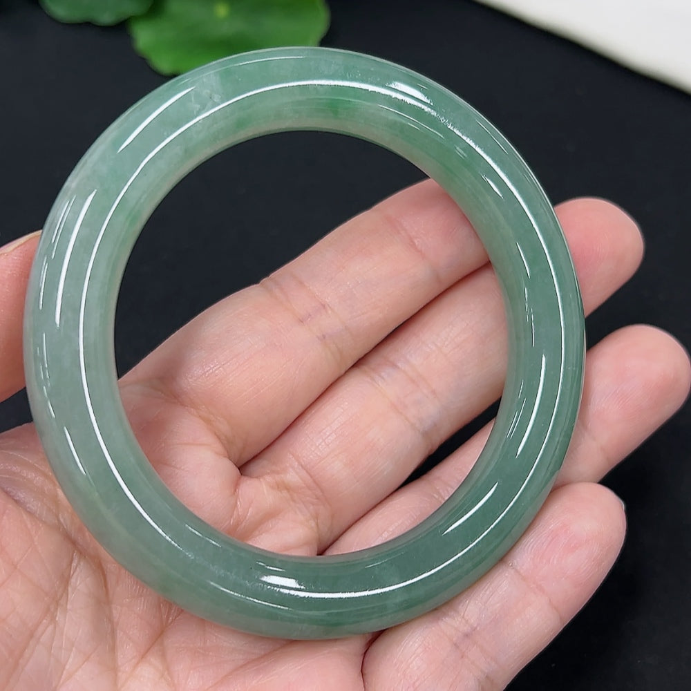 Jadeite round bangle in size 54.3 with a total weight of 58.4g, showcasing smooth, polished jadeite from HKHQ.