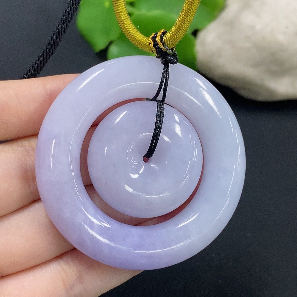 Jadeite mother-and-child toggle pendant by HKHQ, featuring detailed jade carvings and a secure toggle clasp, weighs approximately 55.29g.