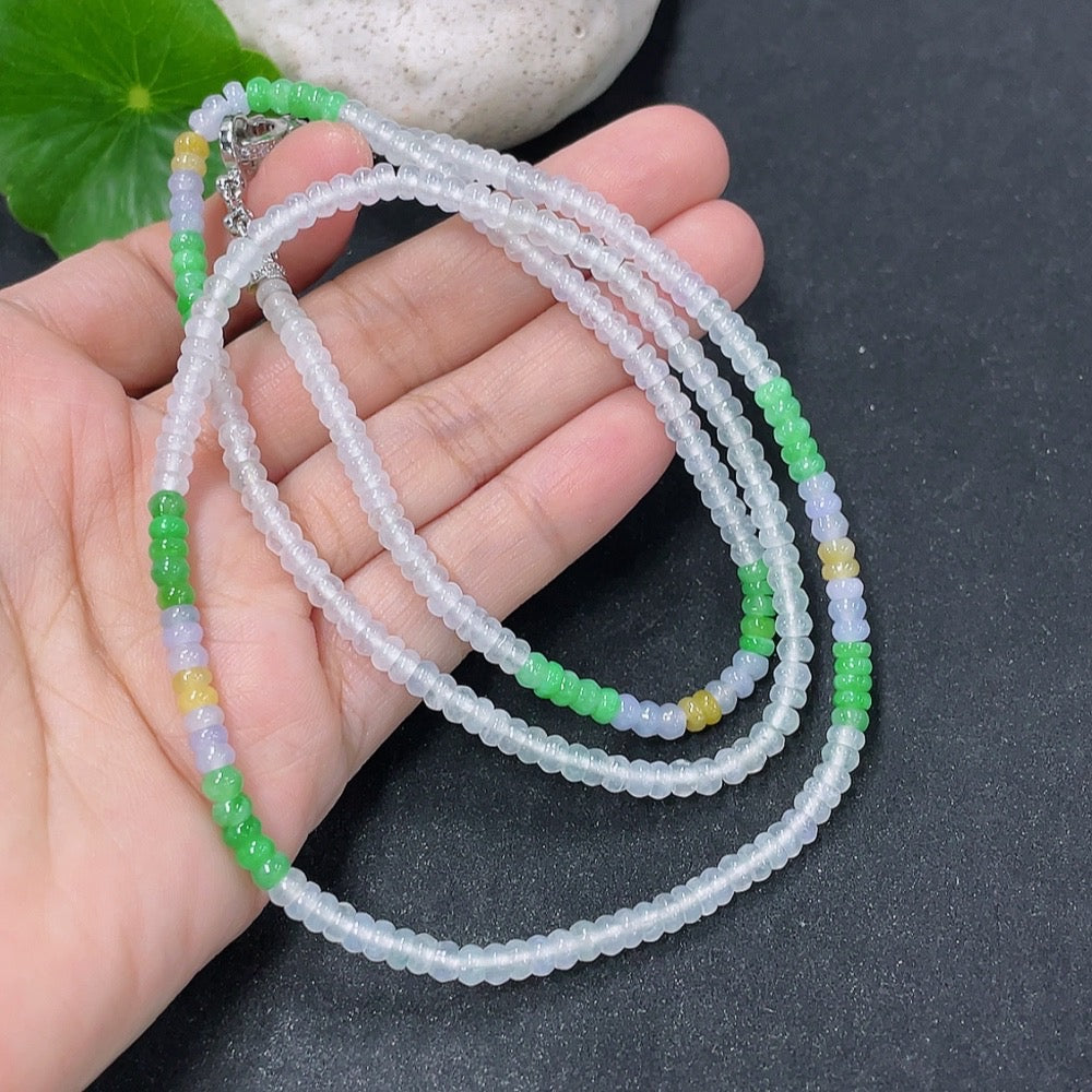 Jadeite bead necklace with 3.7mm beads from HKHQ, featuring a string of smooth, green jade beads on a white background.