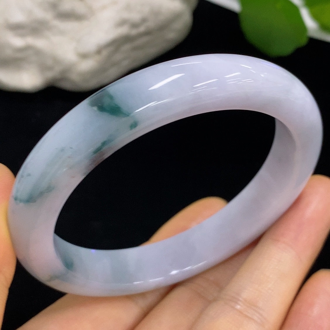 Jadeite round bangle with size 57.6 and weight approximately 54.77g, crafted by HKHQ, featuring smooth, polished jade surface.