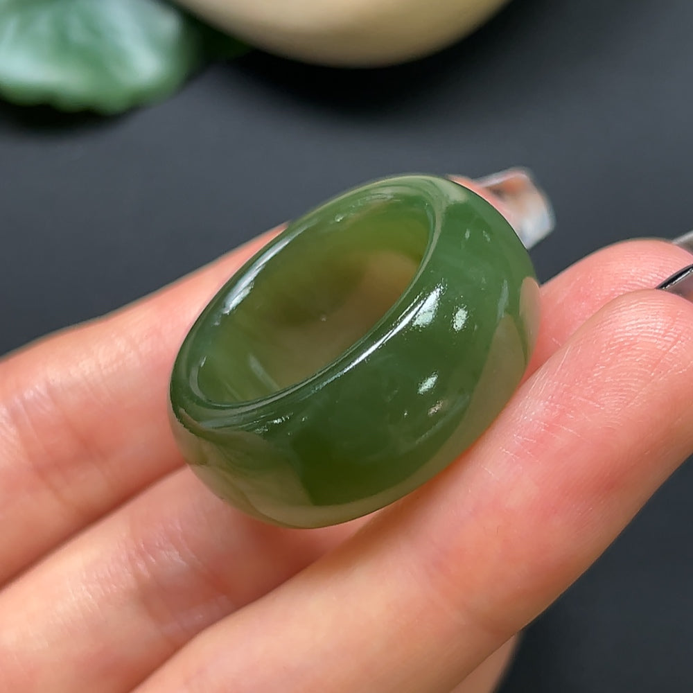 Hetian jade thimble jewelry piece by HKHQ, size 24, weighing approximately 14.37g, showcasing smooth, polished jade craftsmanship.