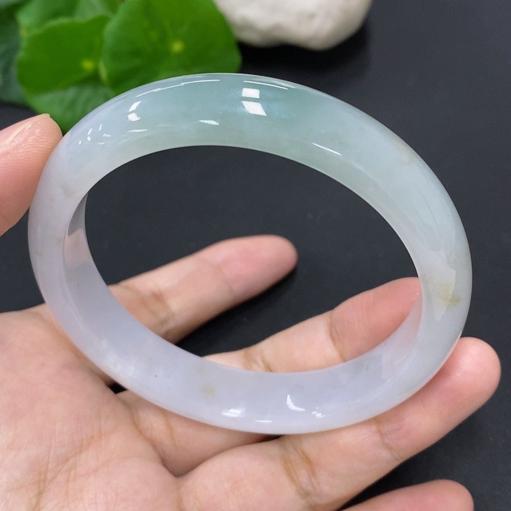 Jadeite round bangle with 53g weight and size 58.7, crafted by HKHQ, showcasing smooth, polished jadeite surface.