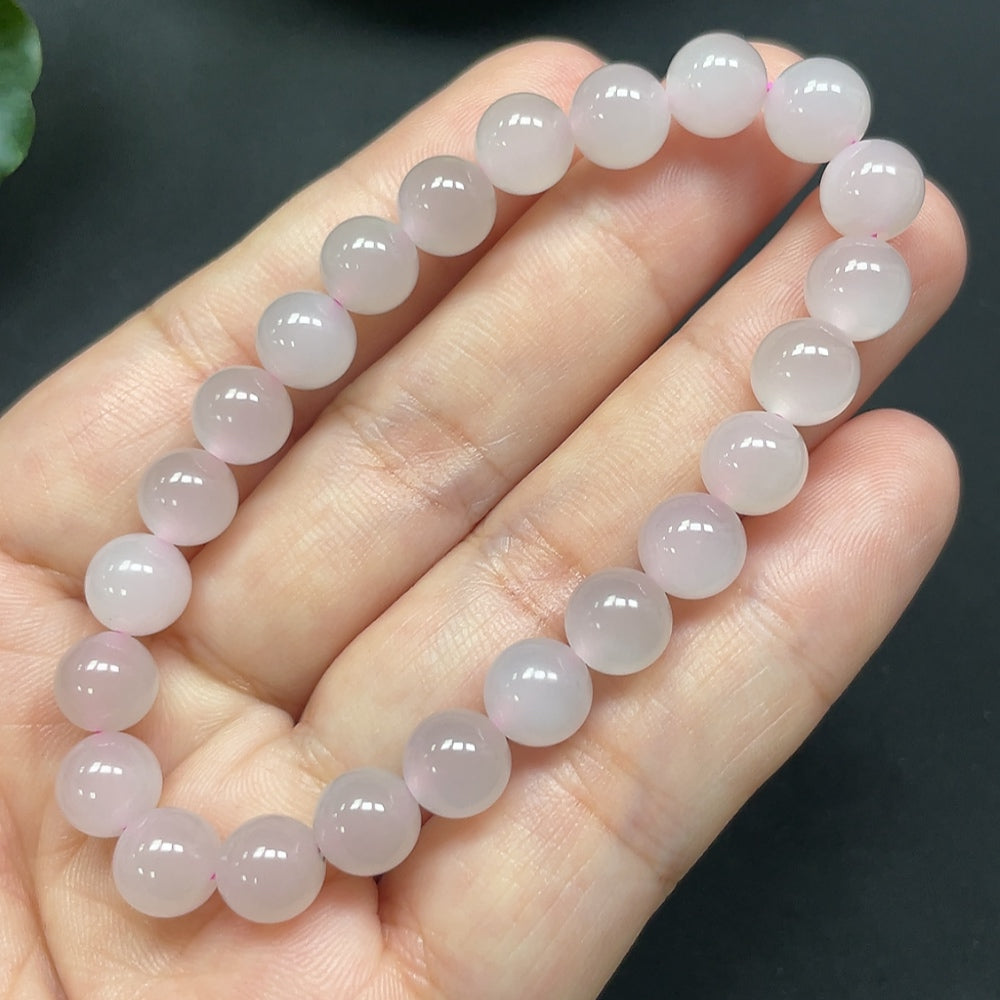 HKHQ Hetian Jade bracelet with 7.7mm beads, showcasing smooth, polished green jade stones on a delicate jewelry bracelet.