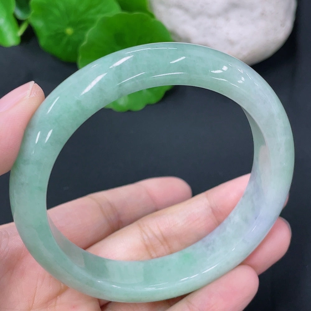 Jadeite round bangle with a 56.3mm diameter and 55.7g weight, crafted by HKHQ, featuring smooth, polished jade surface.