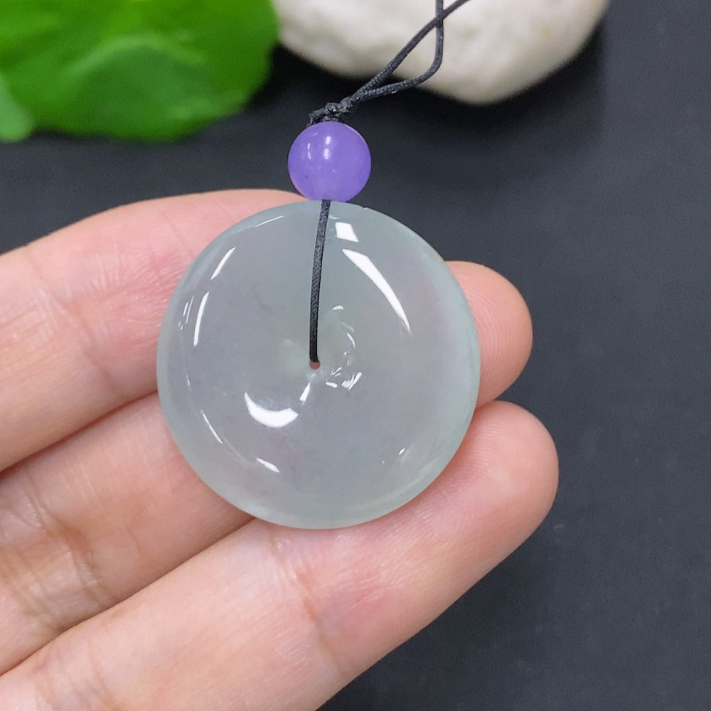 Jadeite Peace Knot pendant from HKHQ, approximately 7.6 grams, showcasing intricate craftsmanship and vibrant green jade beads.