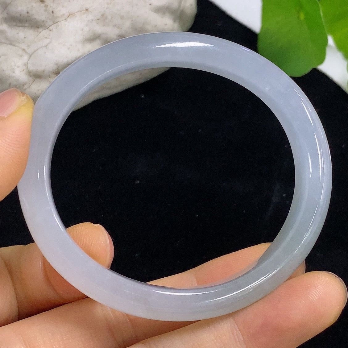HKHQ Jadeite Concubine Bracelet, 54.5/48.8 size, crafted from smooth green jadeite, weight approximately 35.72g, close-up view.