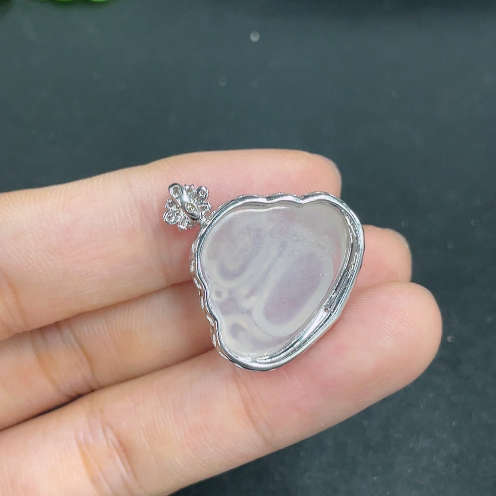Jadeite Buddha pendant with 18k gold and diamond accents, weighing approximately 3.9g, from HKHQ.
