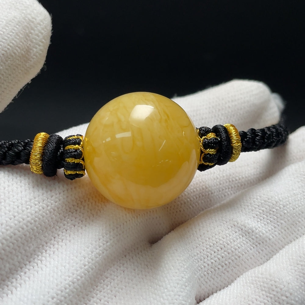 Amber beeswax pendant necklace with cord, approx. 25.2mm size, weighing 14.39g, by HKHQ.