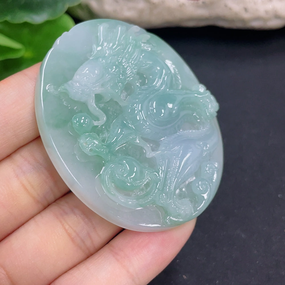 Jadeite dragon pendant necklace from HKHQ, weighing 41.06g, featuring a detailed green jadeite dragon design on a necklace chain.