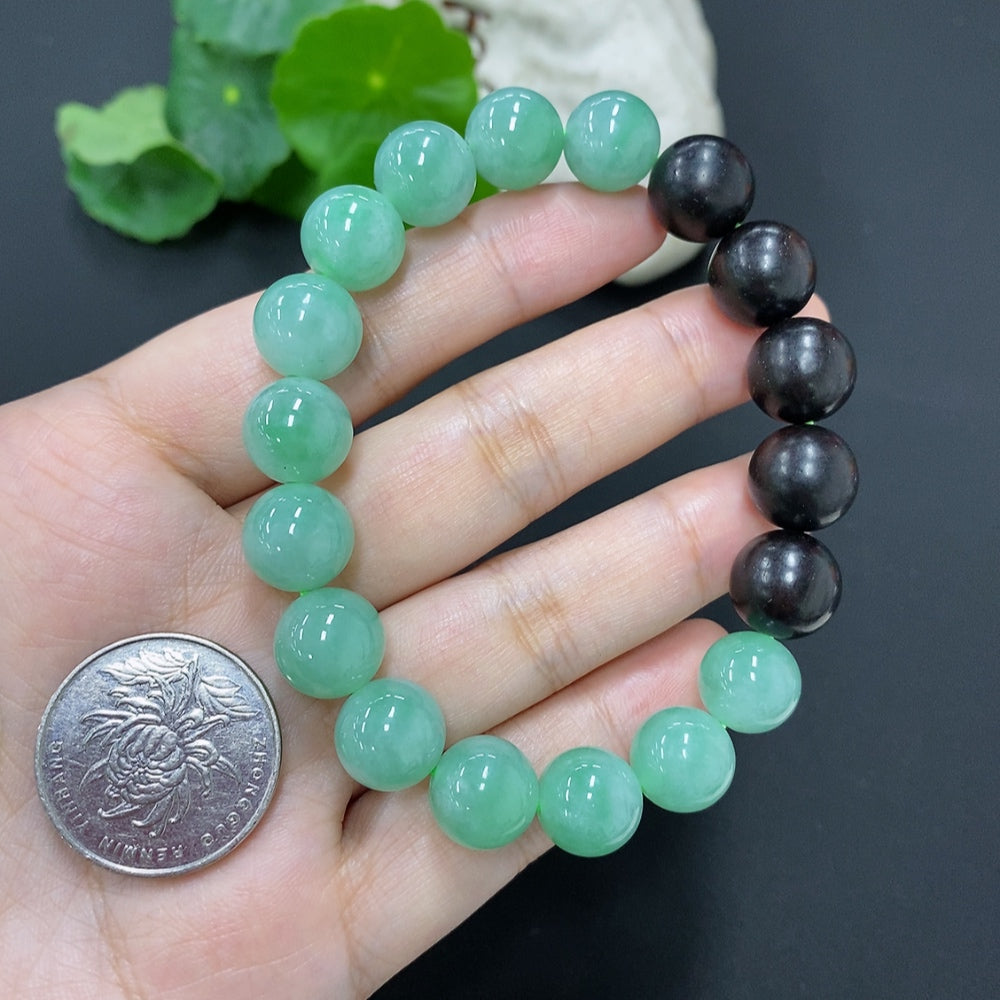 Jadeite bead necklace with 11.2mm jade beads, HKHQ brand, weighing approximately 39.3 grams, displayed on a neutral background.