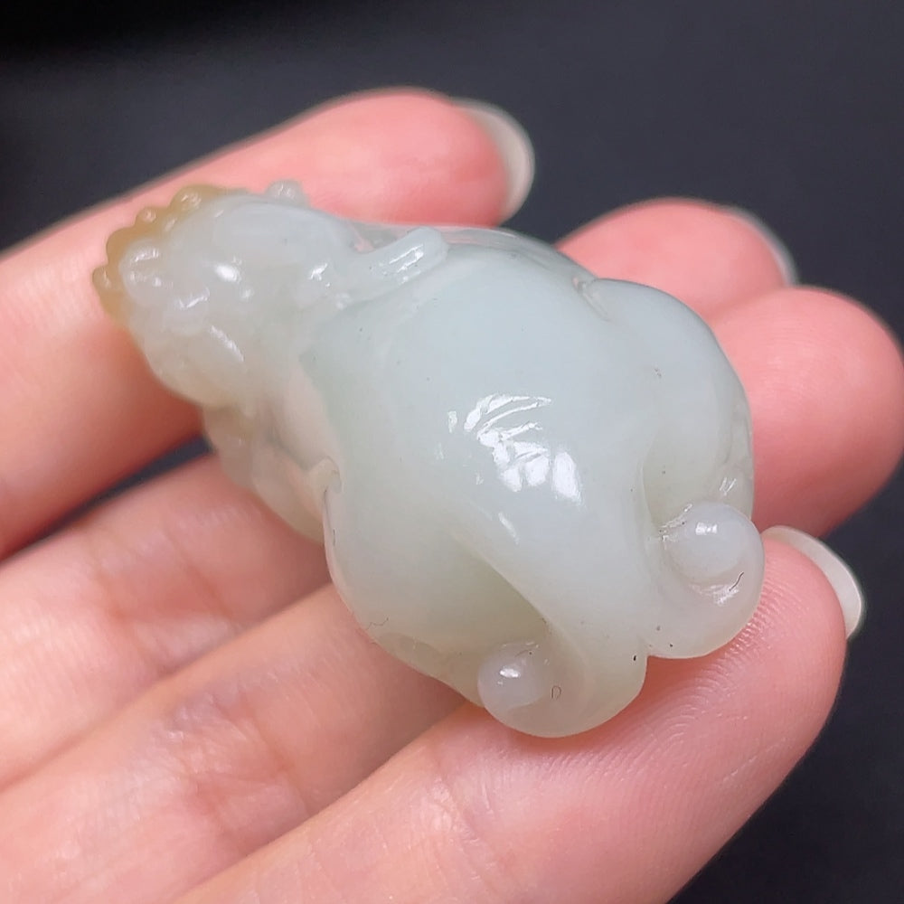 Hetian jade Pixiu pendant from HKHQ featuring intricate carving, weighs approximately 73.49 grams, showcasing traditional craftsmanship.