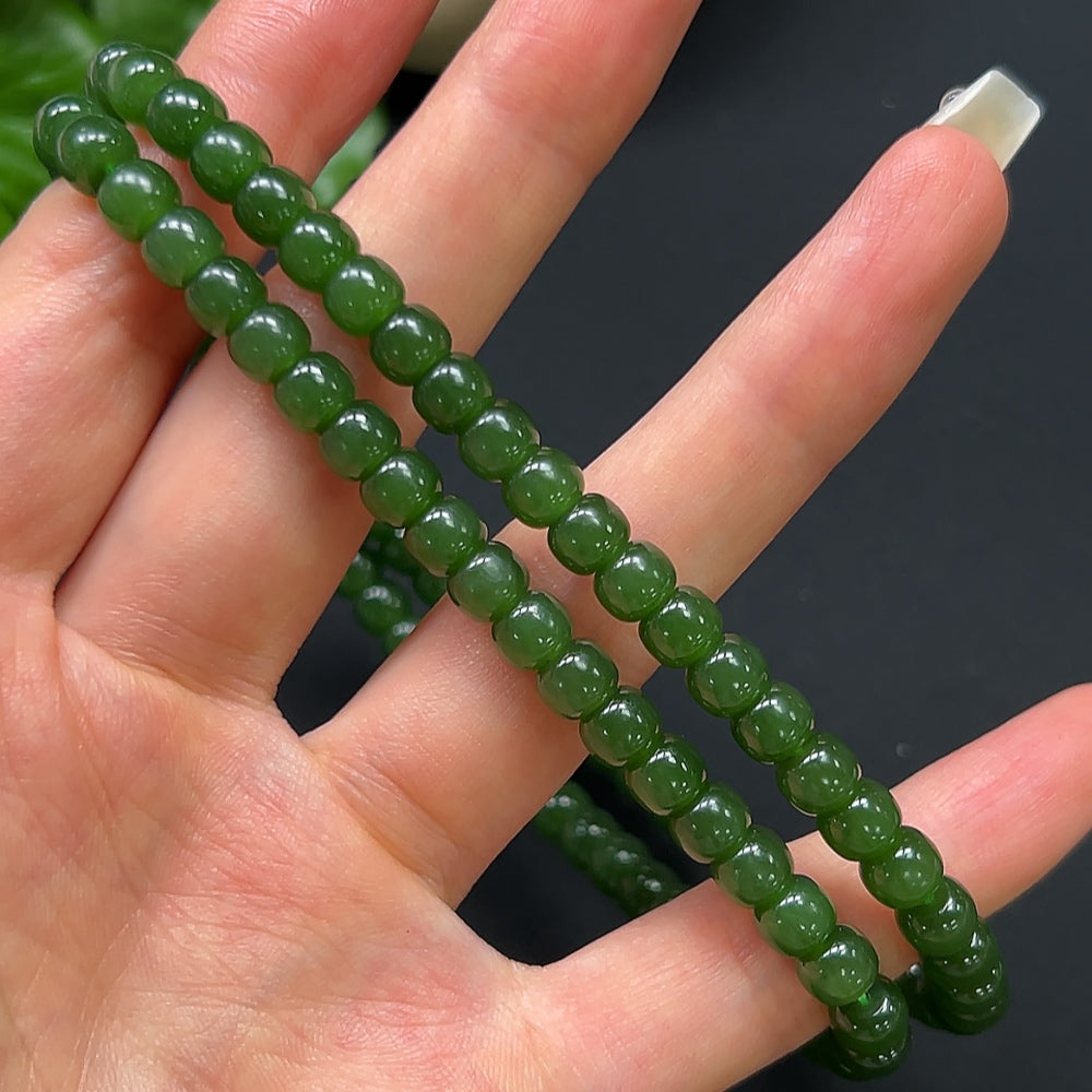 HKHQ Hetian Jade bead necklace with 6.2mm non-gold beads, featuring smooth, polished green jade stones on a delicate string.