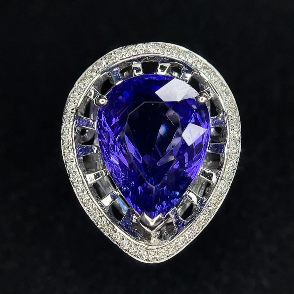 18K gold tanzanite ring with diamond accents, size 11, featuring vibrant blue gemstone and sparkling diamond details.