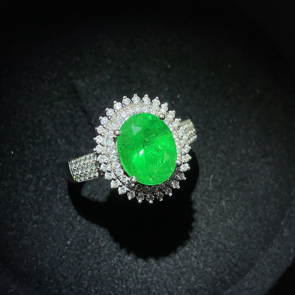 Emerald set ring with gemstones in 18K gold, size 15, clarity enhanced, weighing approximately 4.39g, by HKHQ.