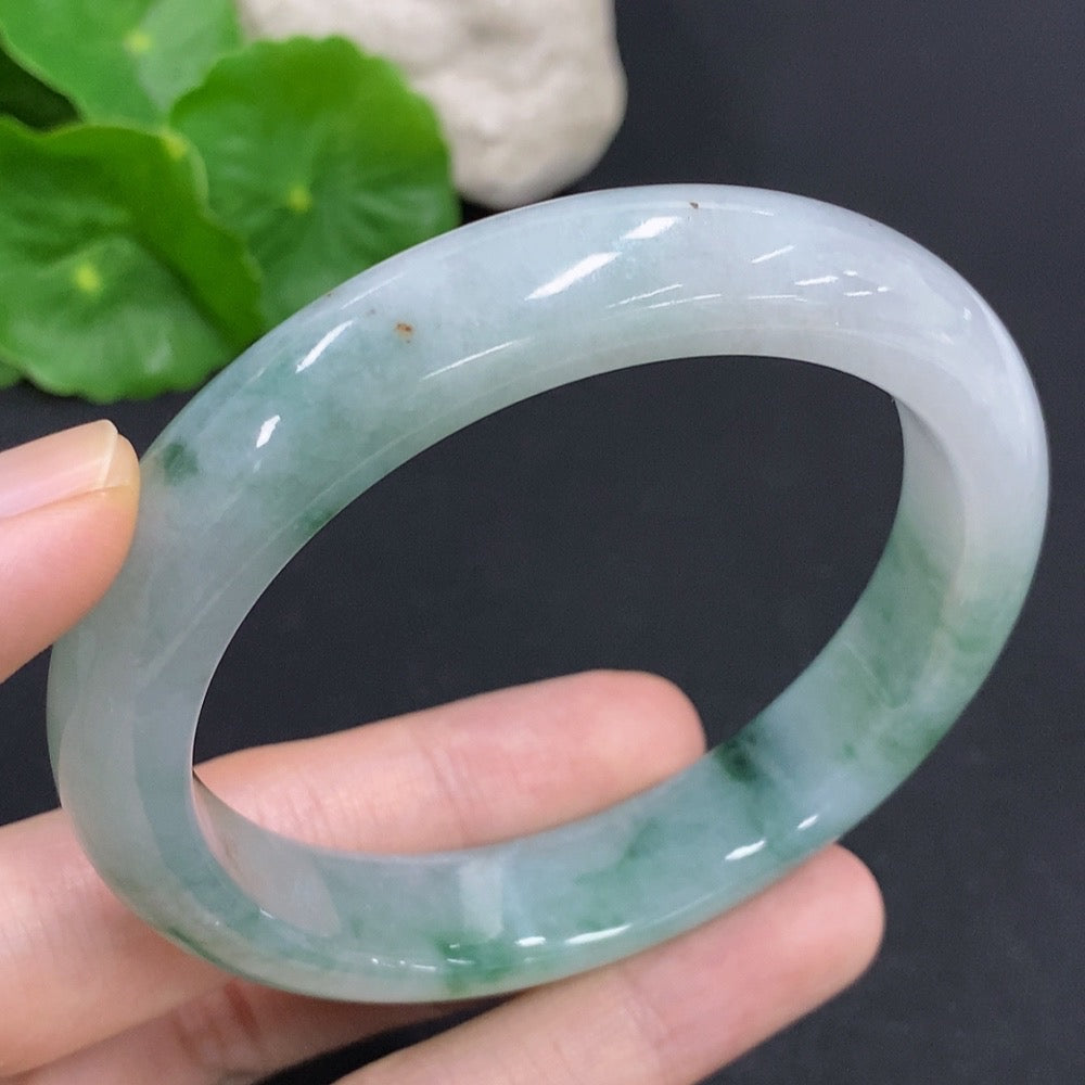 Jadeite round bangle with HKHQ branding, weighs 65.6g, size 60, showcasing smooth, polished jadeite surface.