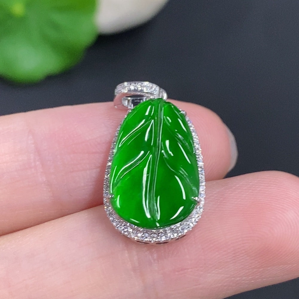 Jadeite leaf pendant with 18k gold setting and diamond accents, weighing approximately 2.1g, from HKHQ.