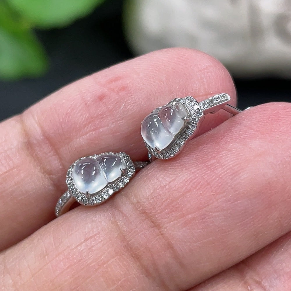 Jadeite gourd stud earrings by HKHQ with 18k gold and diamond inlays, featuring a smooth jade surface and elegant design.