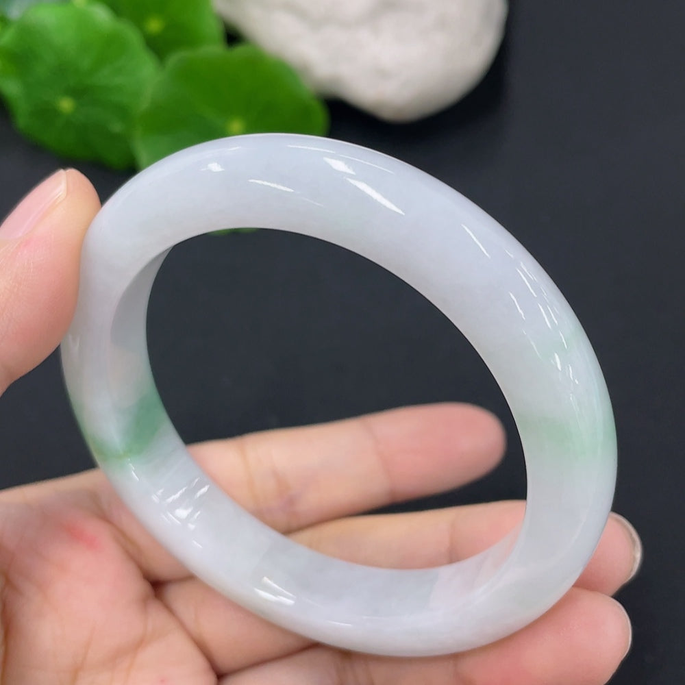 HKHQ jadeite round bangle with a 52.5mm size and approximately 46g weight, showcasing smooth, polished jade jewelry.