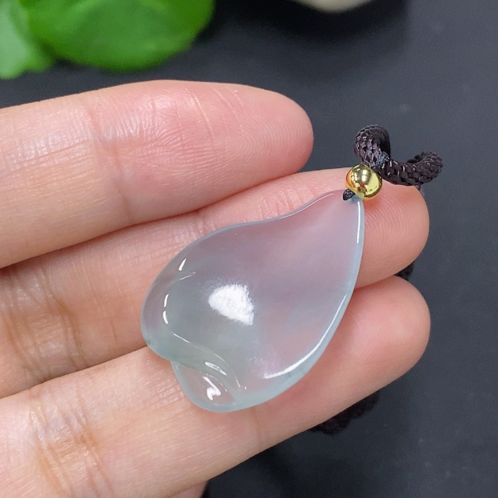 Jadeite freeform pendant with natural green jade shown on a rope, total weight approximately 7.2 grams, by HKHQ.