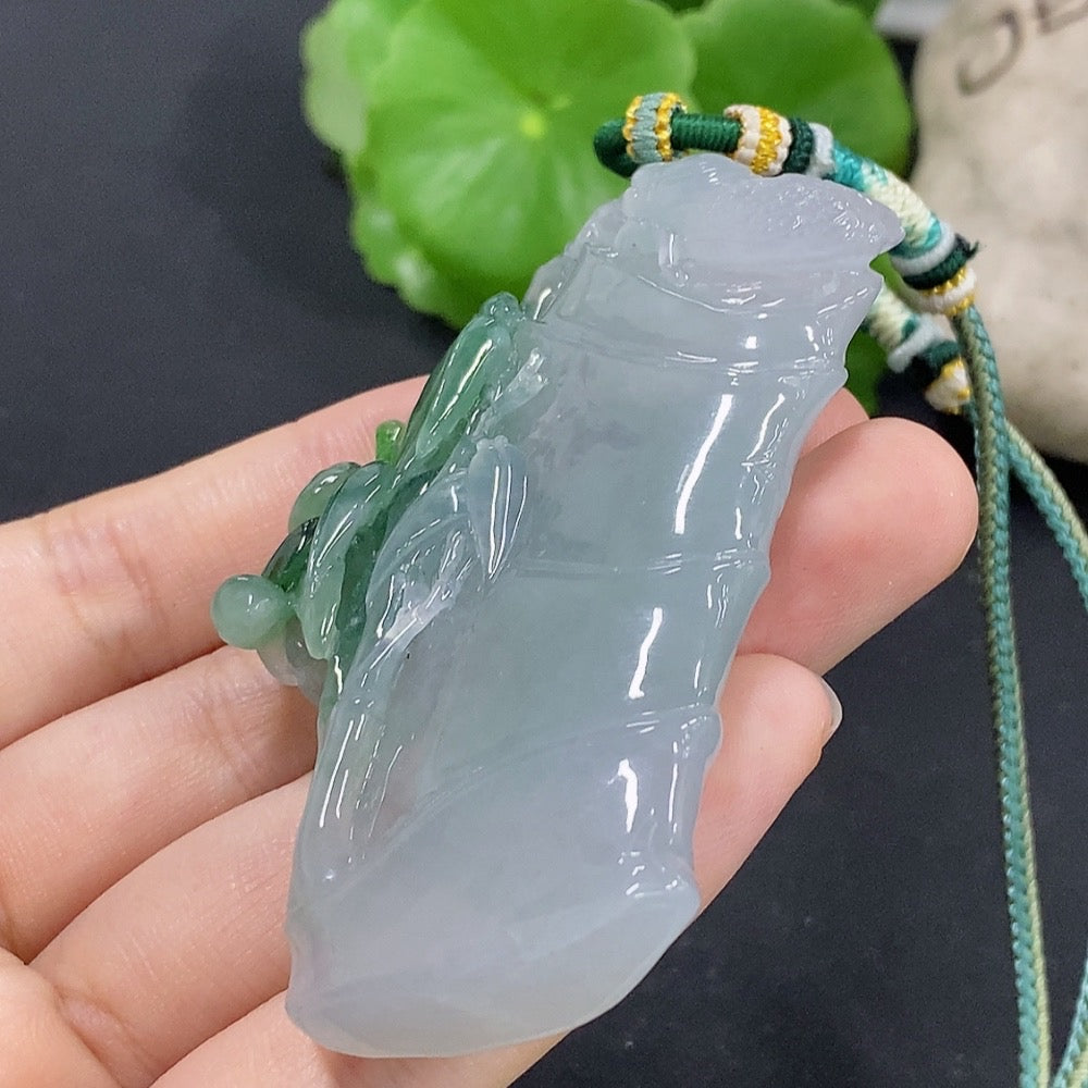 Jadeite bamboo pendant with mineral accents, crafted by HKHQ, weighing approximately 59.89g, featuring natural jade and mineral components.