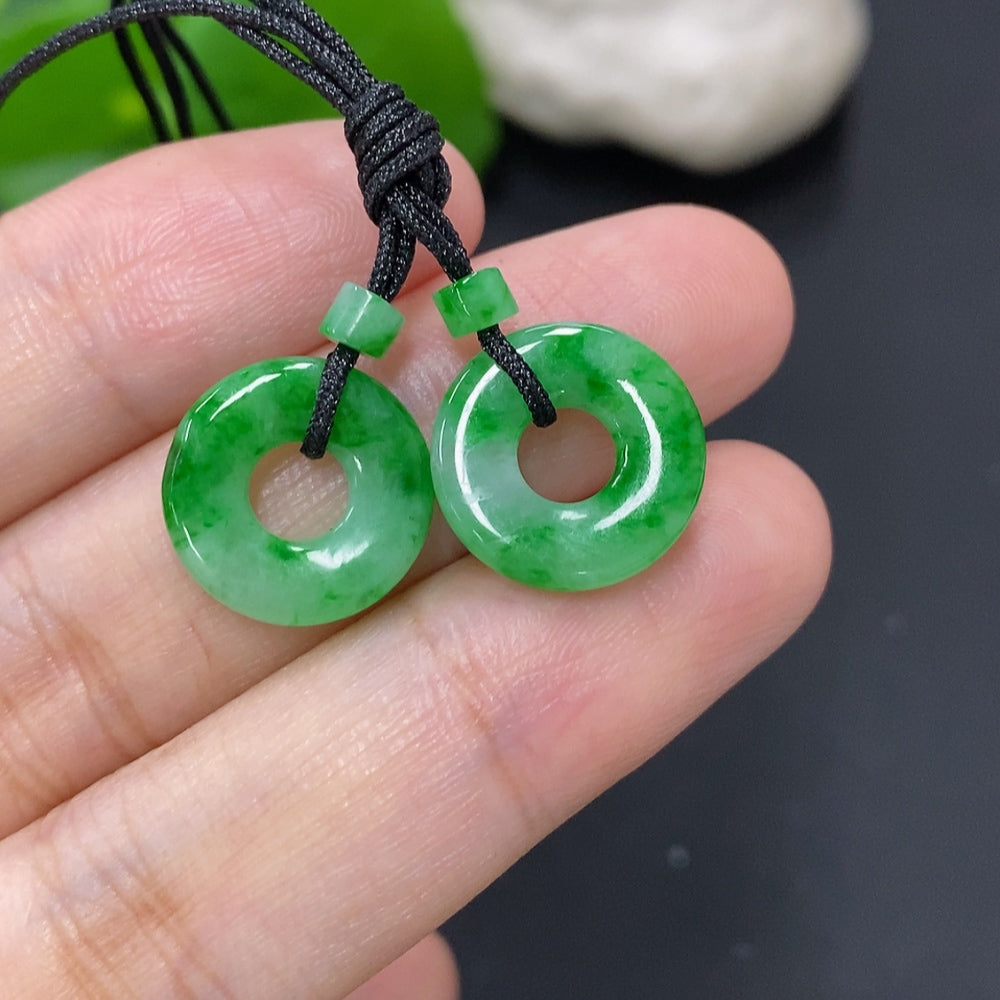 Set of jadeite donut pendants for necklaces, totaling approximately 2.3g, featuring smooth green jadeite stones with natural markings.