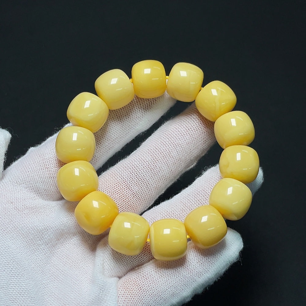 Amber beeswax bracelet by HKHQ featuring natural amber beads, approximately 13.8mm in size, weighing about 22.64g.