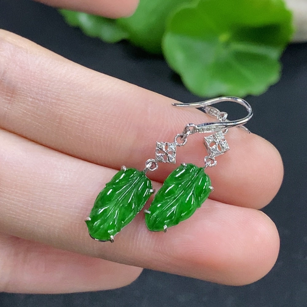 Jadeite leaf inlaid earrings by HKHQ featuring 18k gold and diamond accents, with a total weight of approximately 1.73 grams.