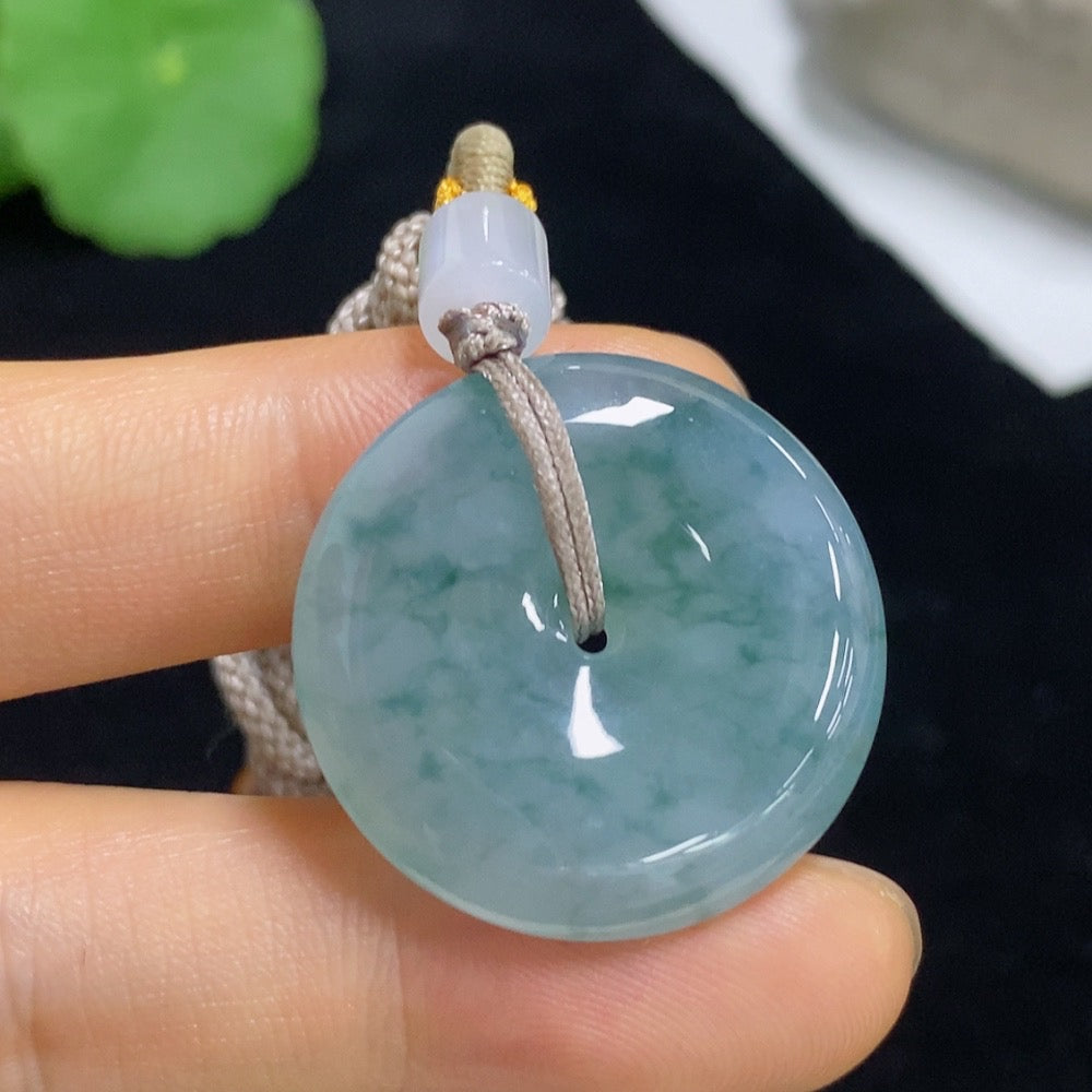 Jadeite Peace Knot pendant with rope, crafted from green jade, weighs approximately 12.94g, showcasing smooth, polished surface.