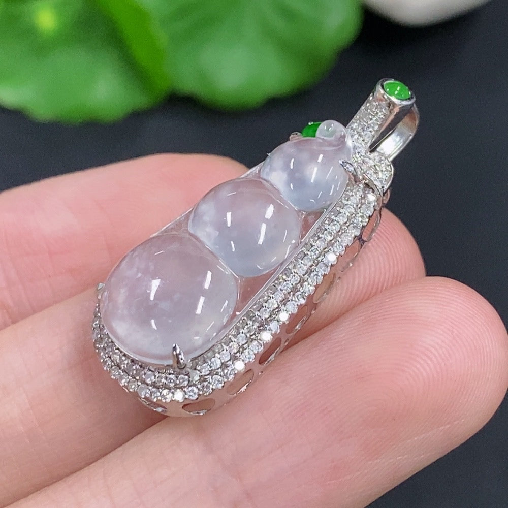 Jadeite lucky bean pendant with 18K gold accents and diamond details, weighing approximately 3.3g, from HKHQ.