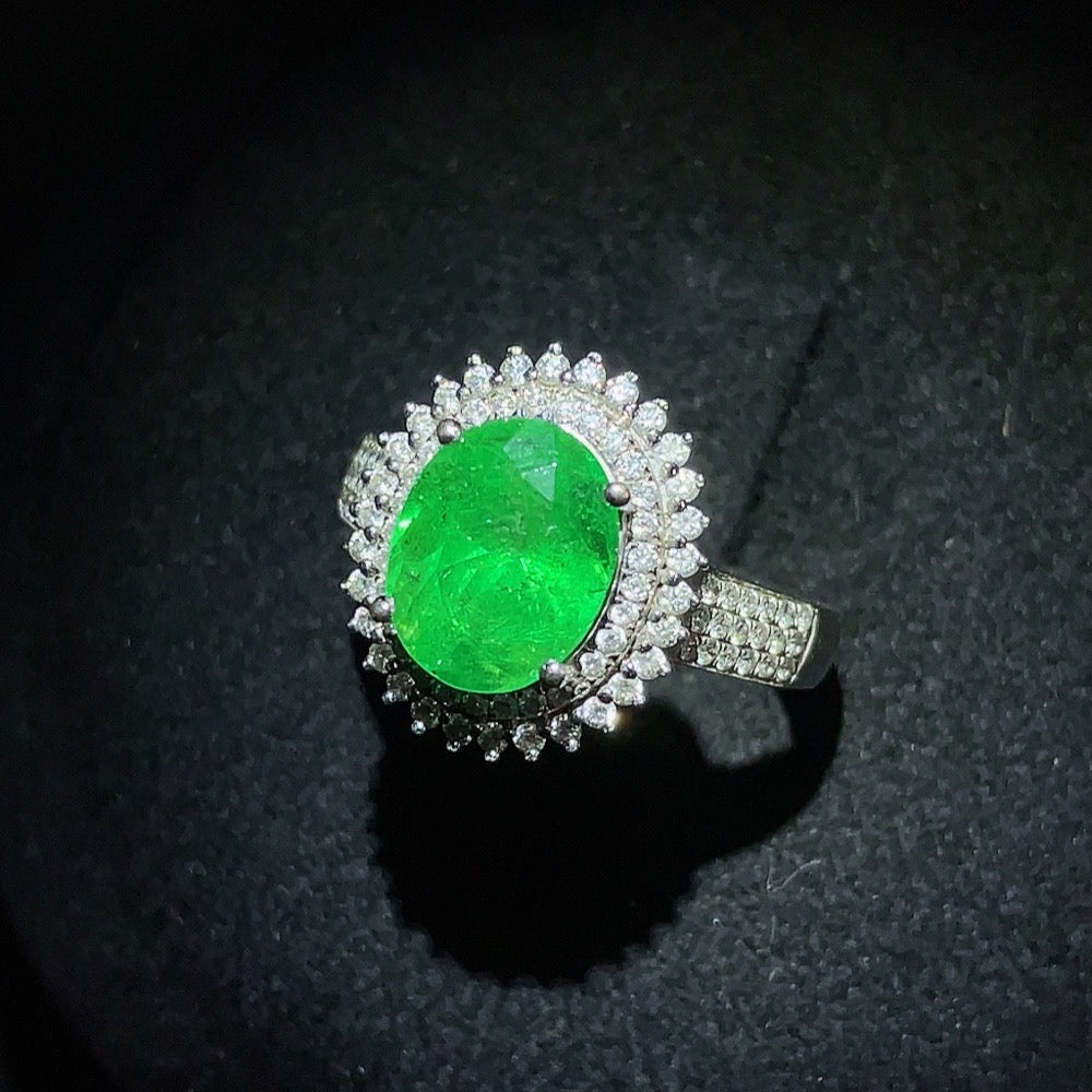 Emerald set ring by HKHQ featuring gemstones, 18K gold, size 15, with clarity enhancement and total weight around 4.39g.