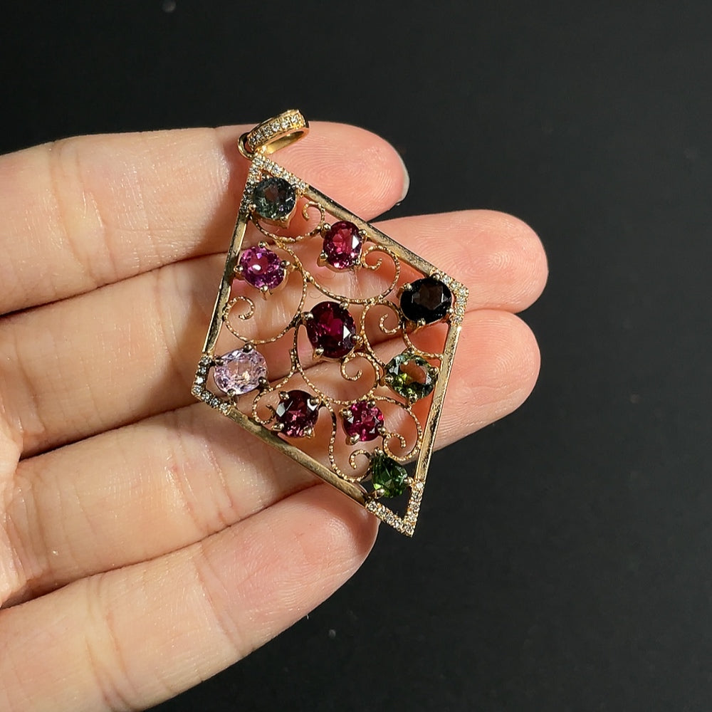 Tourmaline pendant with spinel (light purple, gray blue) and diamond accents, 18k gold