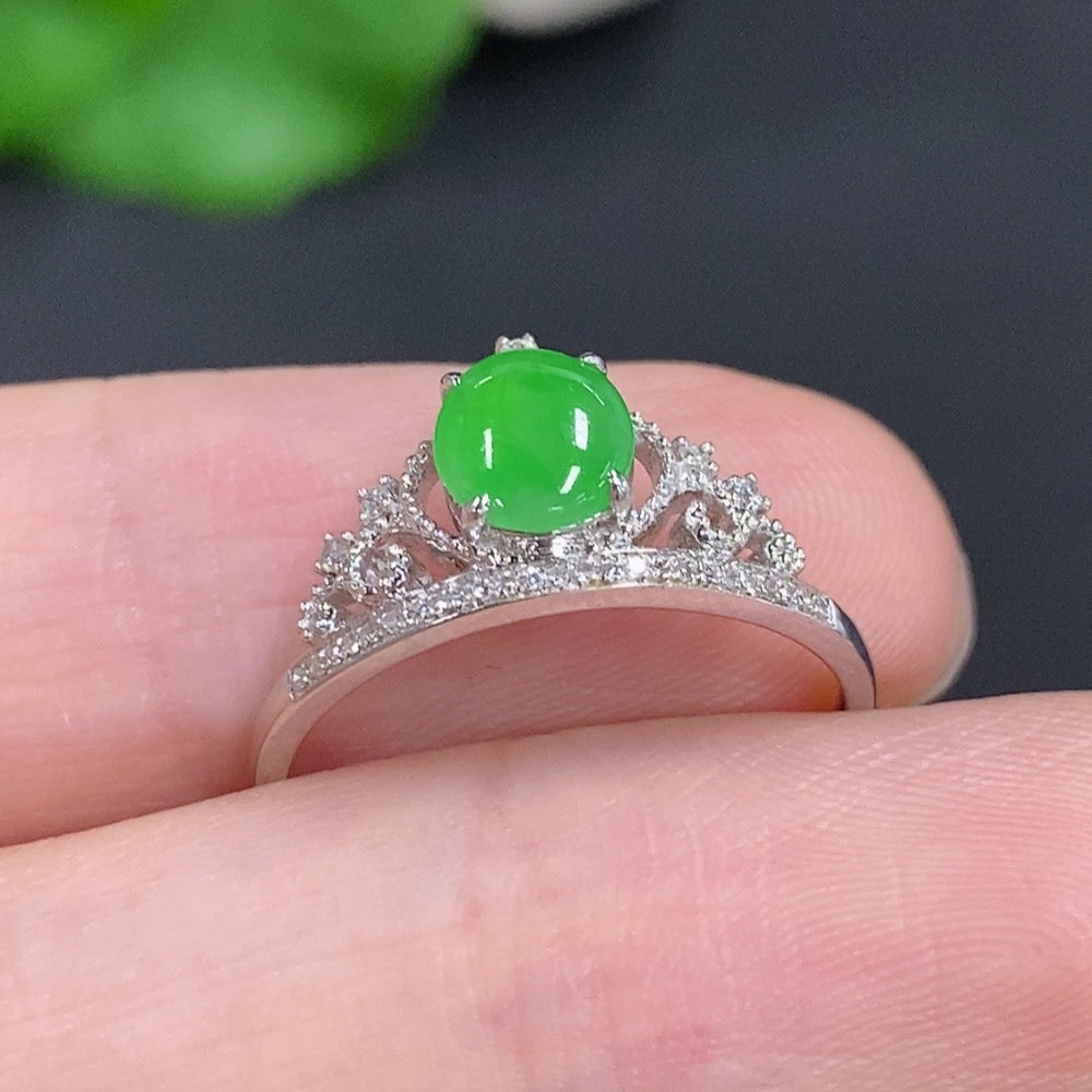 Elegant jadeite cabochon ring with diamond accents in 18k gold, size 15, weighing approximately 1.7g.