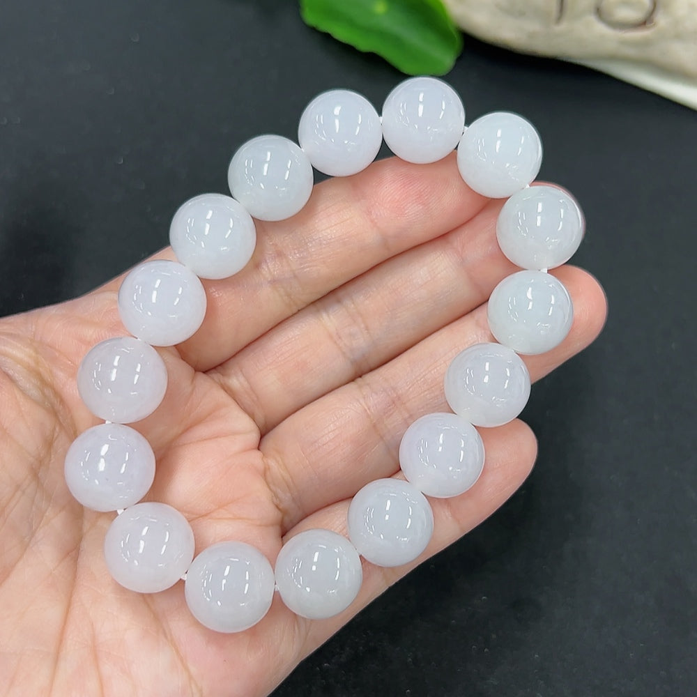 Jadeite bracelet with 12.8mm beads, HKHQ brand, showing the smooth green jadeite stones and clasp detail.
