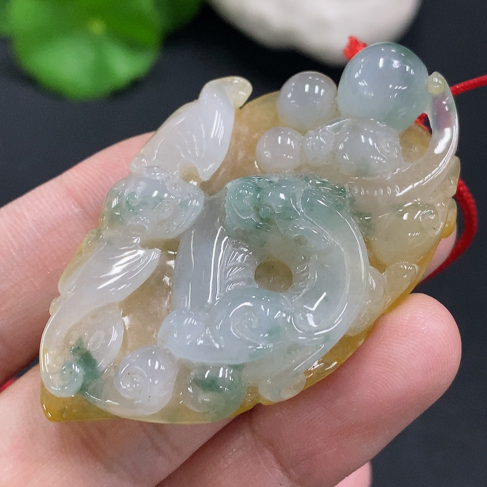 Jadeite pendant with cord, total weight approximately 25.2g (color origin undetermined)
