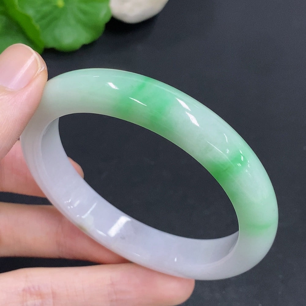 Jadeite round bracelet weighing 44g with mineral inclusions, size 55, crafted by HKHQ, featuring smooth polished jade stones.
