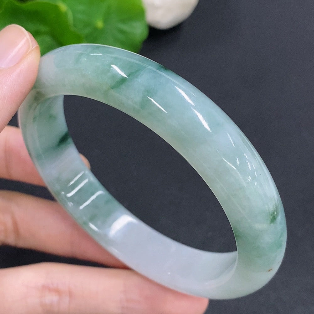 Jadeite round bangle with a 65.6g weight and size 60, showcasing smooth, polished jadeite by HKHQ.