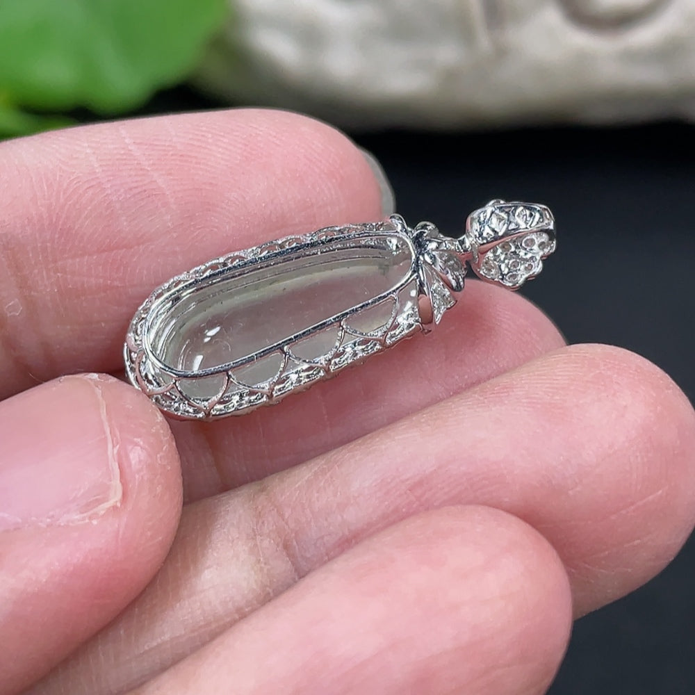 Jadeite blessing melon pendant with 18K gold setting and diamond accents, showcasing intricate craftsmanship and natural green jade.