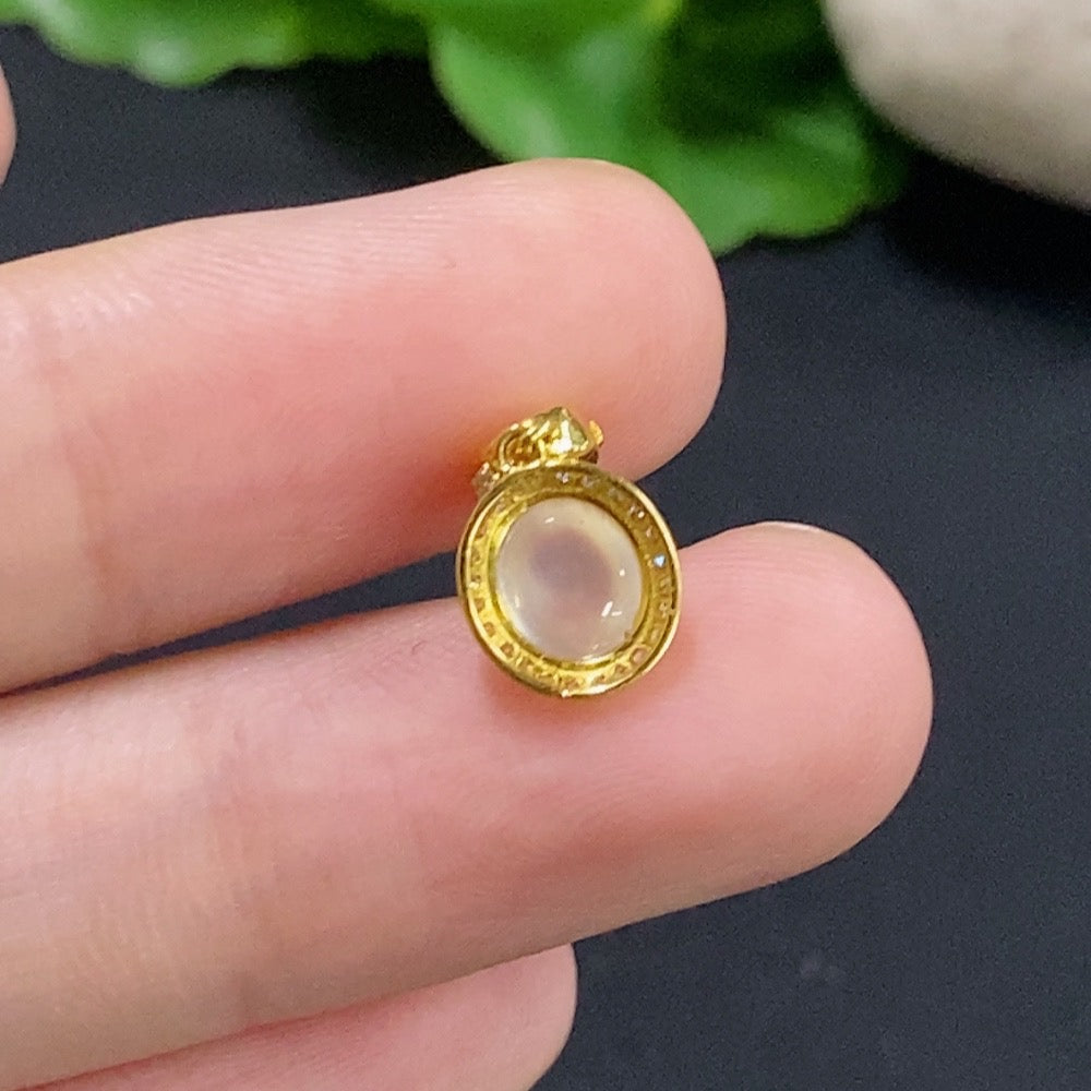 Jadeite cabochon pendant with 18K gold and diamond accents, featuring a delicate necklace from HKHQ.