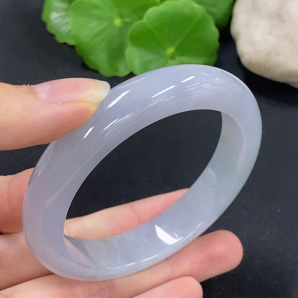 HKHQ jadeite round bangle, size 54.8, showcasing smooth, polished jade surface with elegant round shape and rich green color.