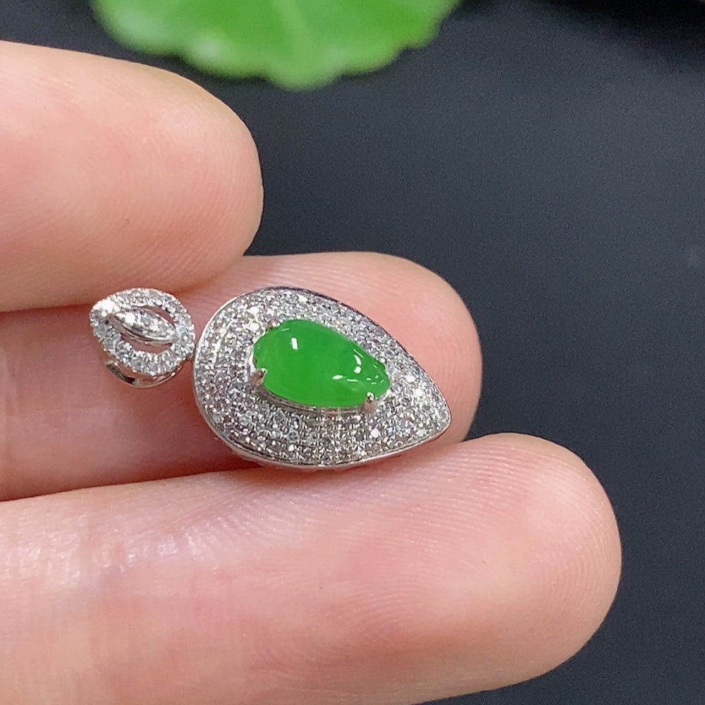Jadeite inlaid pendant with 18k gold and diamond accents, showcasing intricate craftsmanship in a close-up shot.