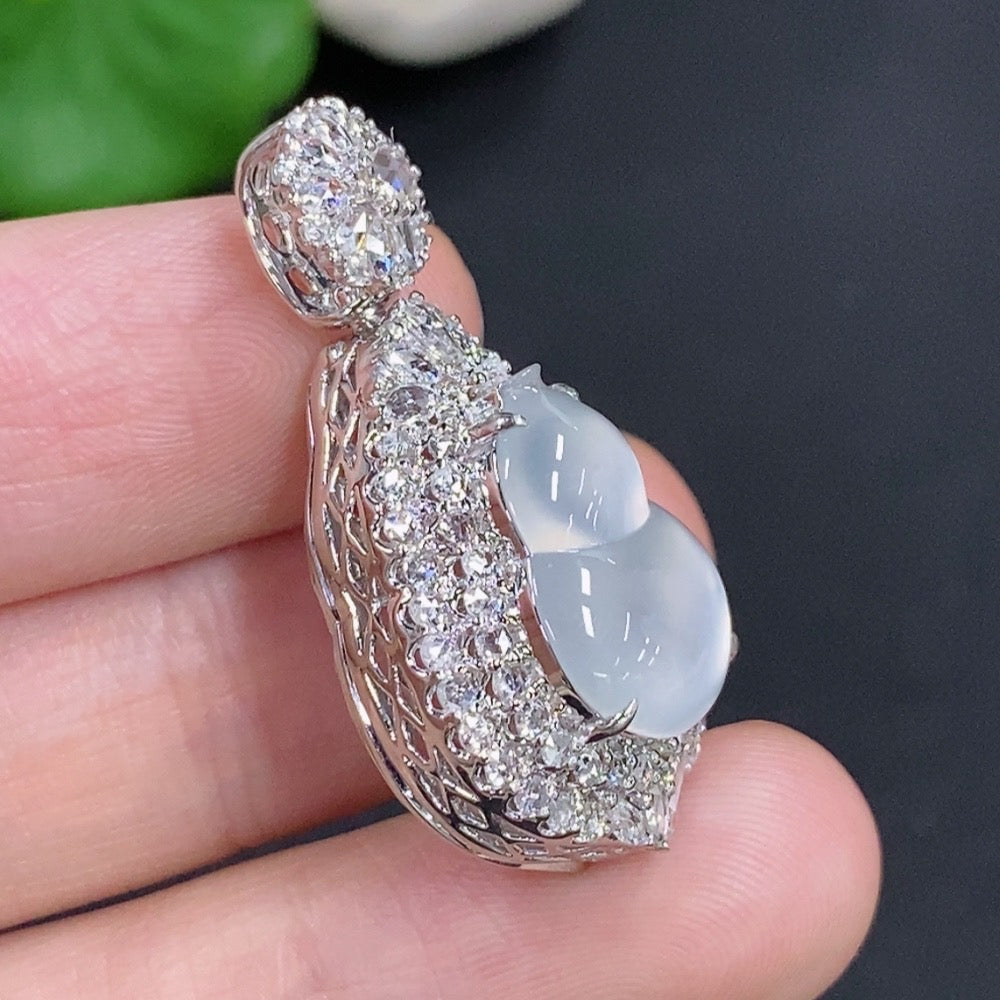 Jadeite gourd inlaid pendant with diamond accents on 18k gold necklace, weighing approx. 7.2g, by HKHQ.