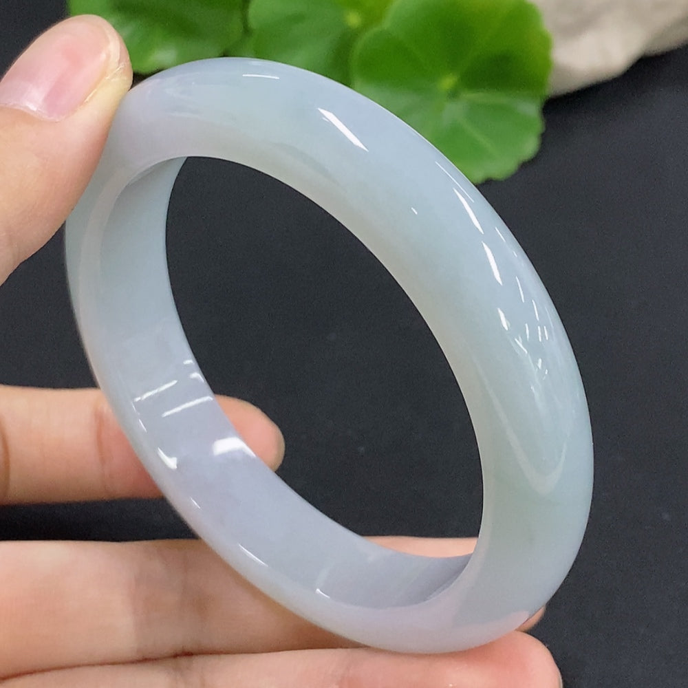 HKHQ jadeite round bangle in size 56.1, weighing 57.8g, featuring smooth, polished green jadeite bracelet with a rounded shape.