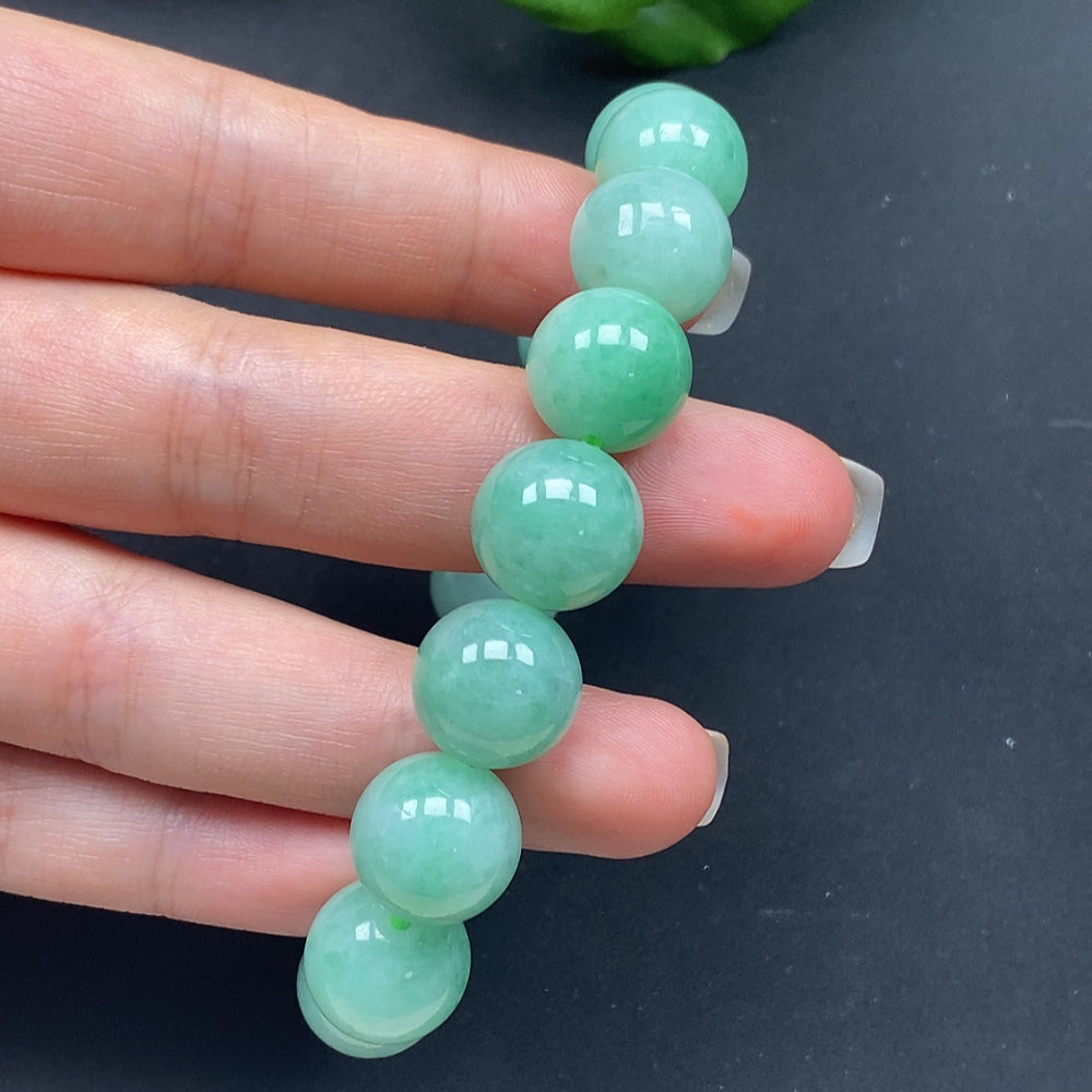 HKHQ jadeite bracelet, size approx. 12.8 inches, total weight 57.85g, showcasing smooth, green jadeite beads on a stylish bracelet.