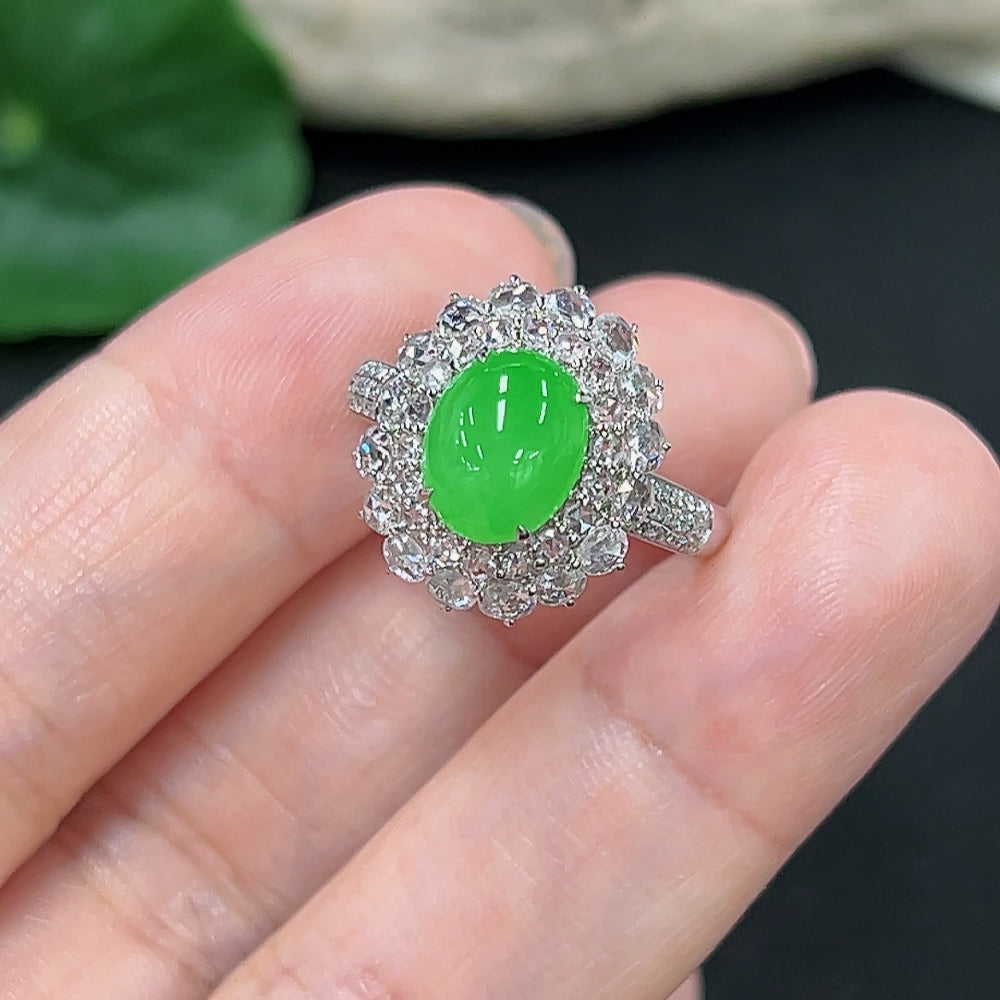 Jadeite ring with diamond accents in 18K gold, size 14, featuring a polished jade stone and delicate diamond details.