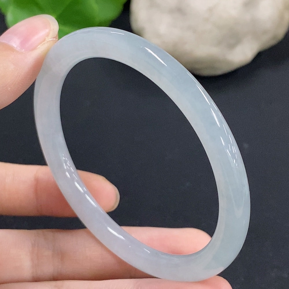 Jadeite round bangle in green jade with size 55.7 and weight 23.89g, showcasing smooth polished surface and elegant design.