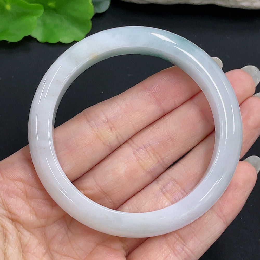 Jadeite round bangle with size 55.1 and weight 55.3g, showcasing smooth, polished jade surface and vibrant green color.