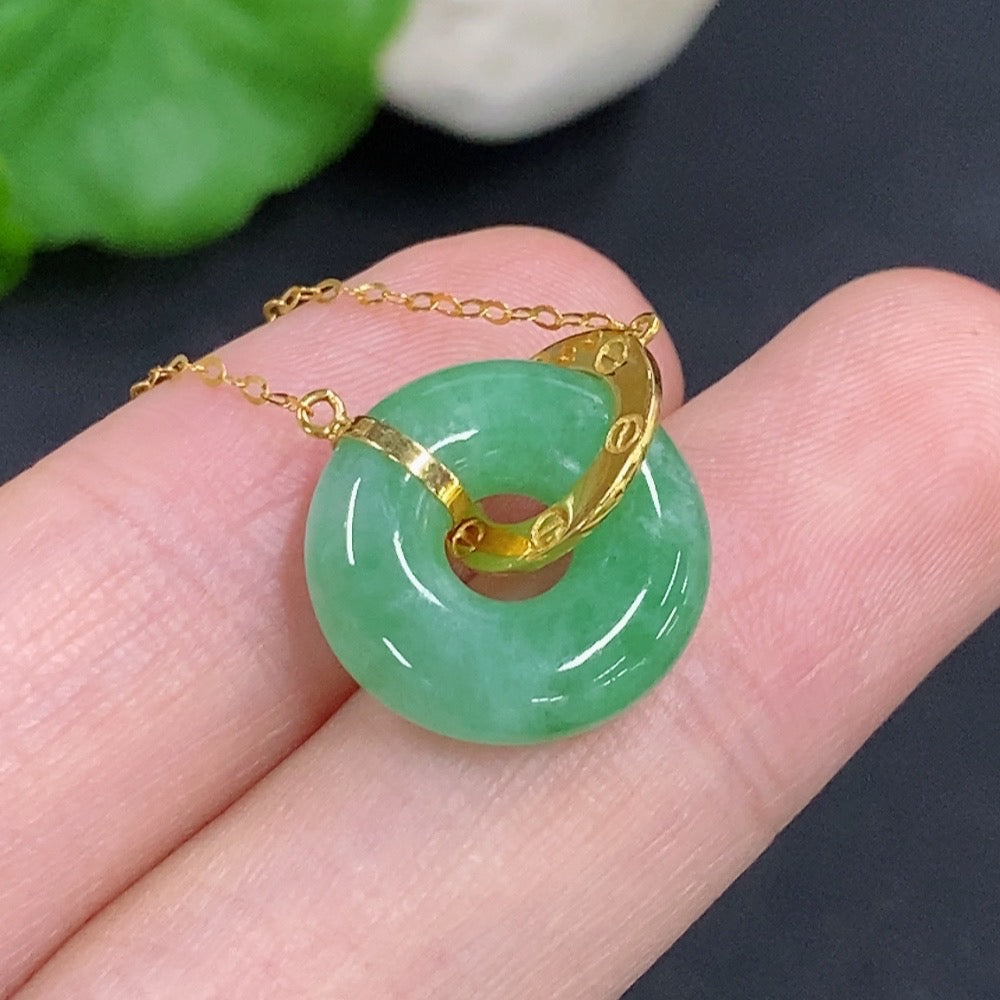 Jadeite donut pendant in 18k gold with chain, HKHQ jewelry, showcasing a smooth, polished jade pendant on a delicate gold chain.