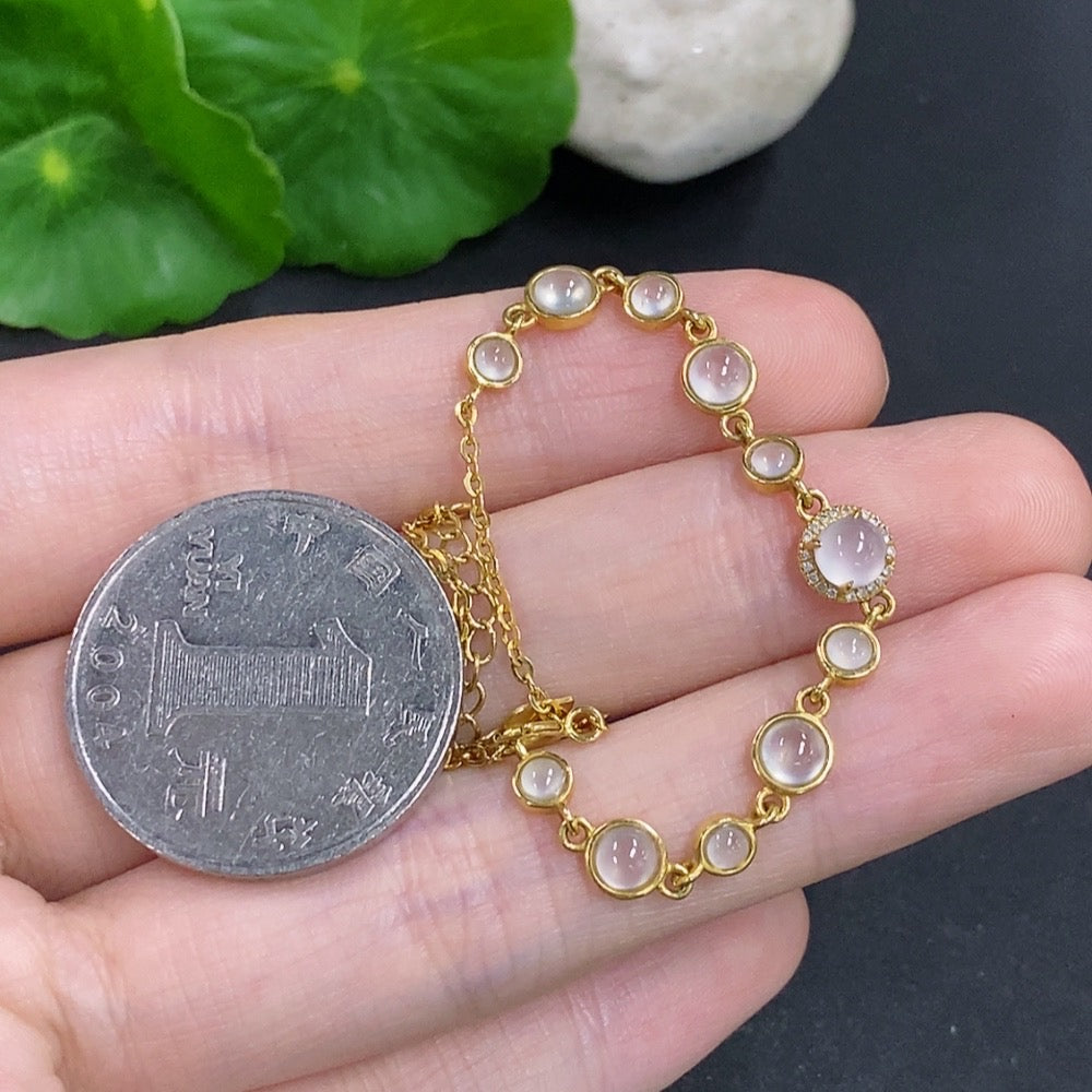 HKHQ jadeite cabochon inlay bracelet with 18k gold and diamond accents, showcasing elegant craftsmanship and vibrant gemstone details